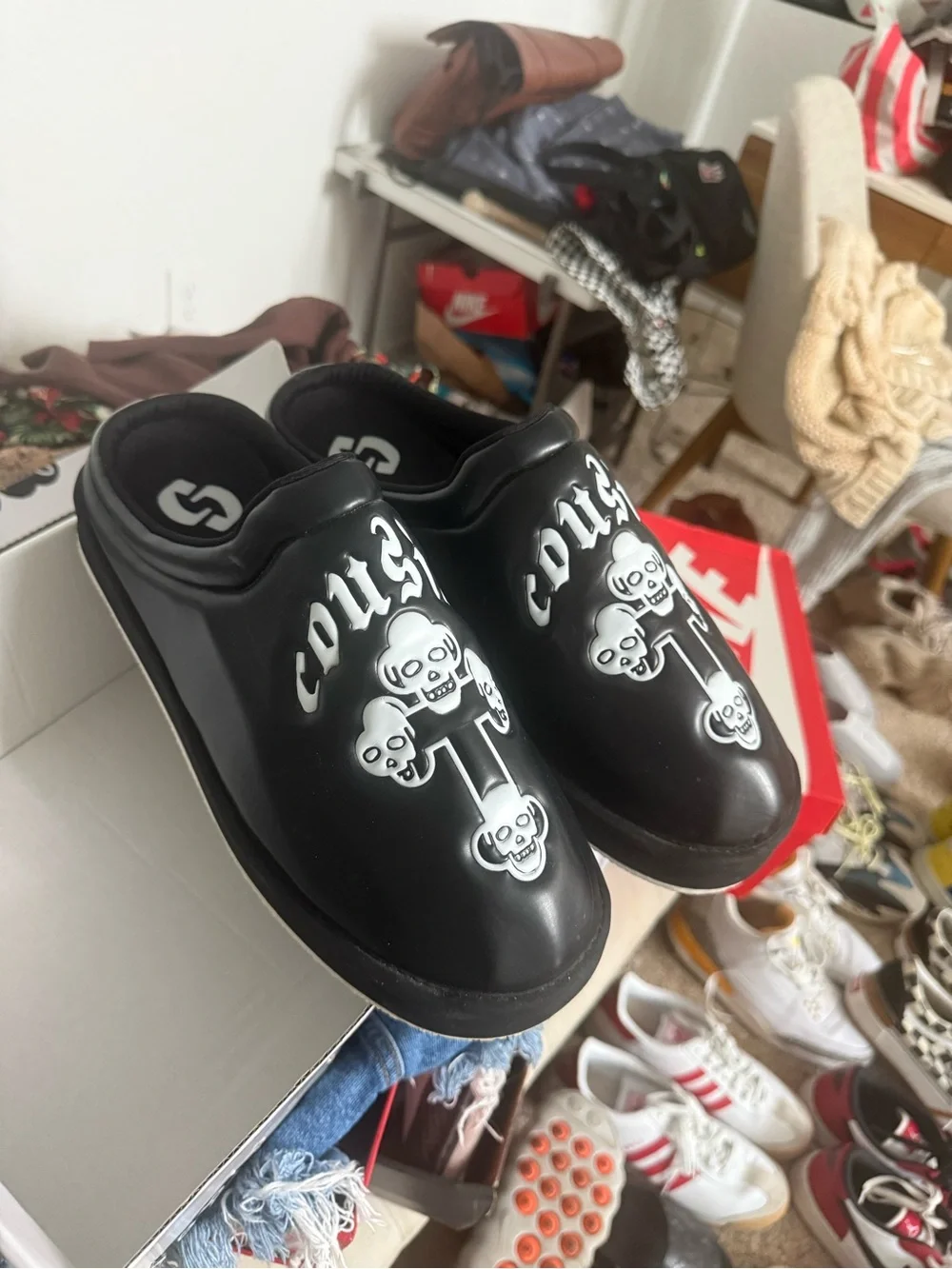Cousin’s custom Black Slip-On Graphic Clog Shoes with Skull Design